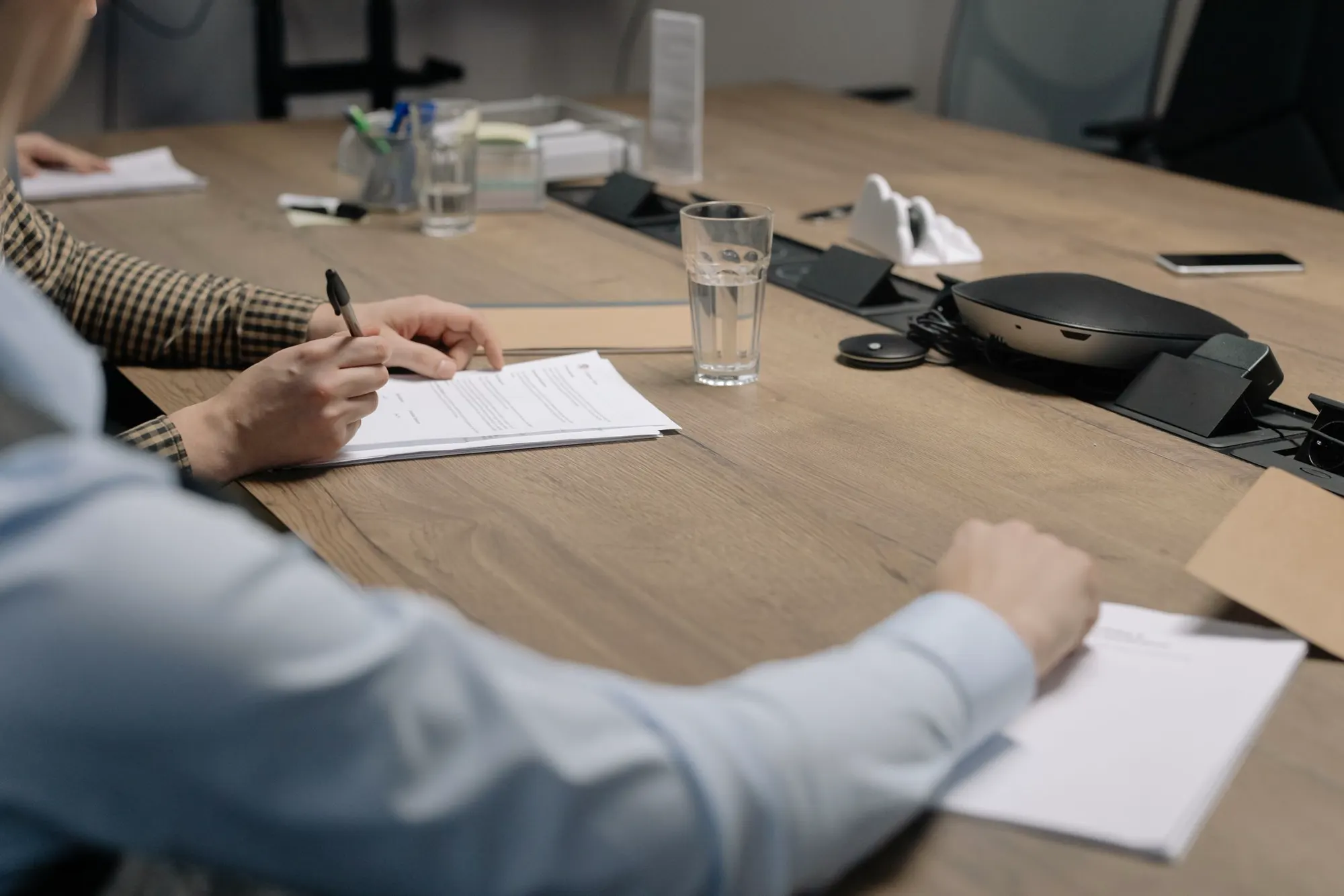 A business representative signing a project agreement