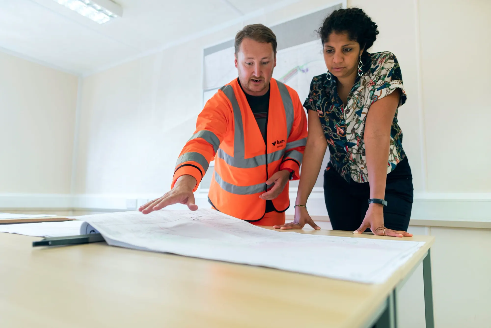 Two engineers reviewing a project plan together